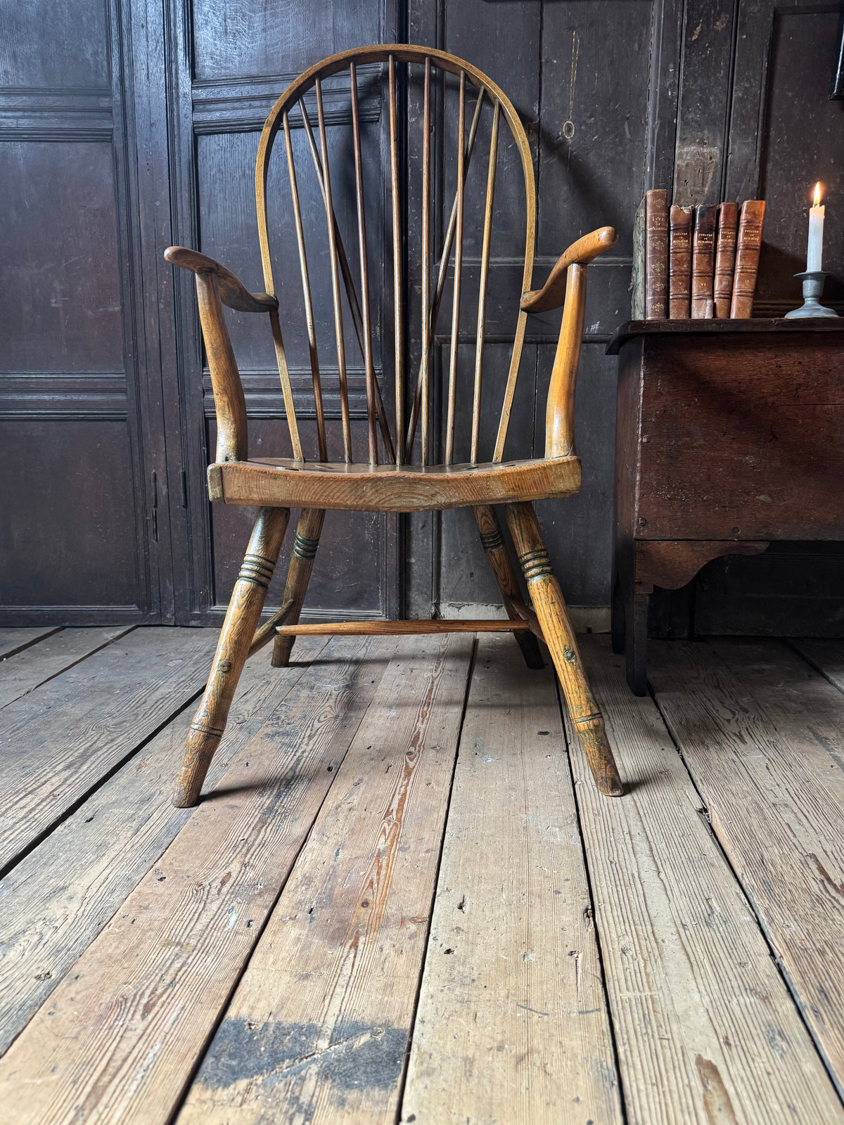 An unusual George III elm and ash high hoop-back Windsor armchair, probably West Country, circa 1800
