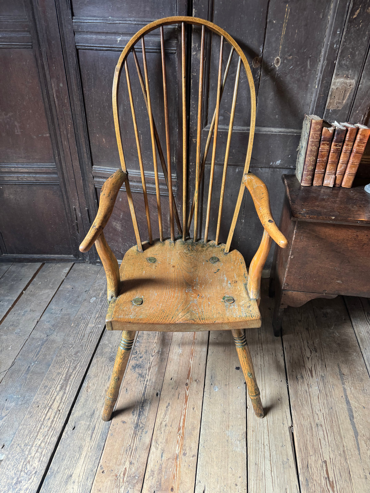 An unusual George III elm and ash high hoop-back Windsor armchair, probably West Country, circa 1800