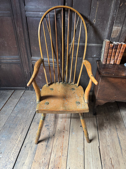 An unusual George III elm and ash high hoop-back Windsor armchair, probably West Country, circa 1800