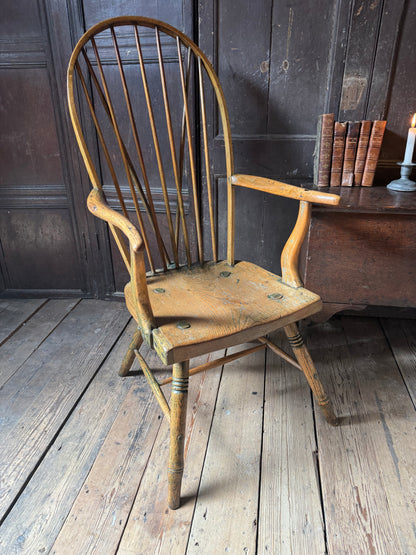 An unusual George III elm and ash high hoop-back Windsor armchair, probably West Country, circa 1800