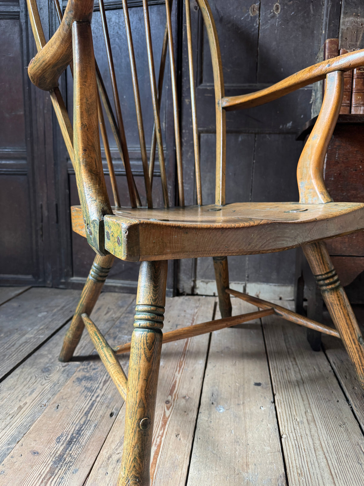 An unusual George III elm and ash high hoop-back Windsor armchair, probably West Country, circa 1800