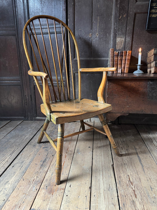 An unusual George III elm and ash high hoop-back Windsor armchair, probably West Country, circa 1800