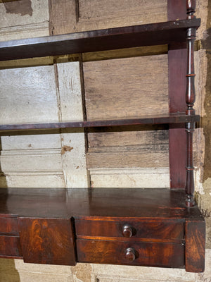 A 19th century set of mahogany apothecary wall shelves with original labels to drawer interiors
