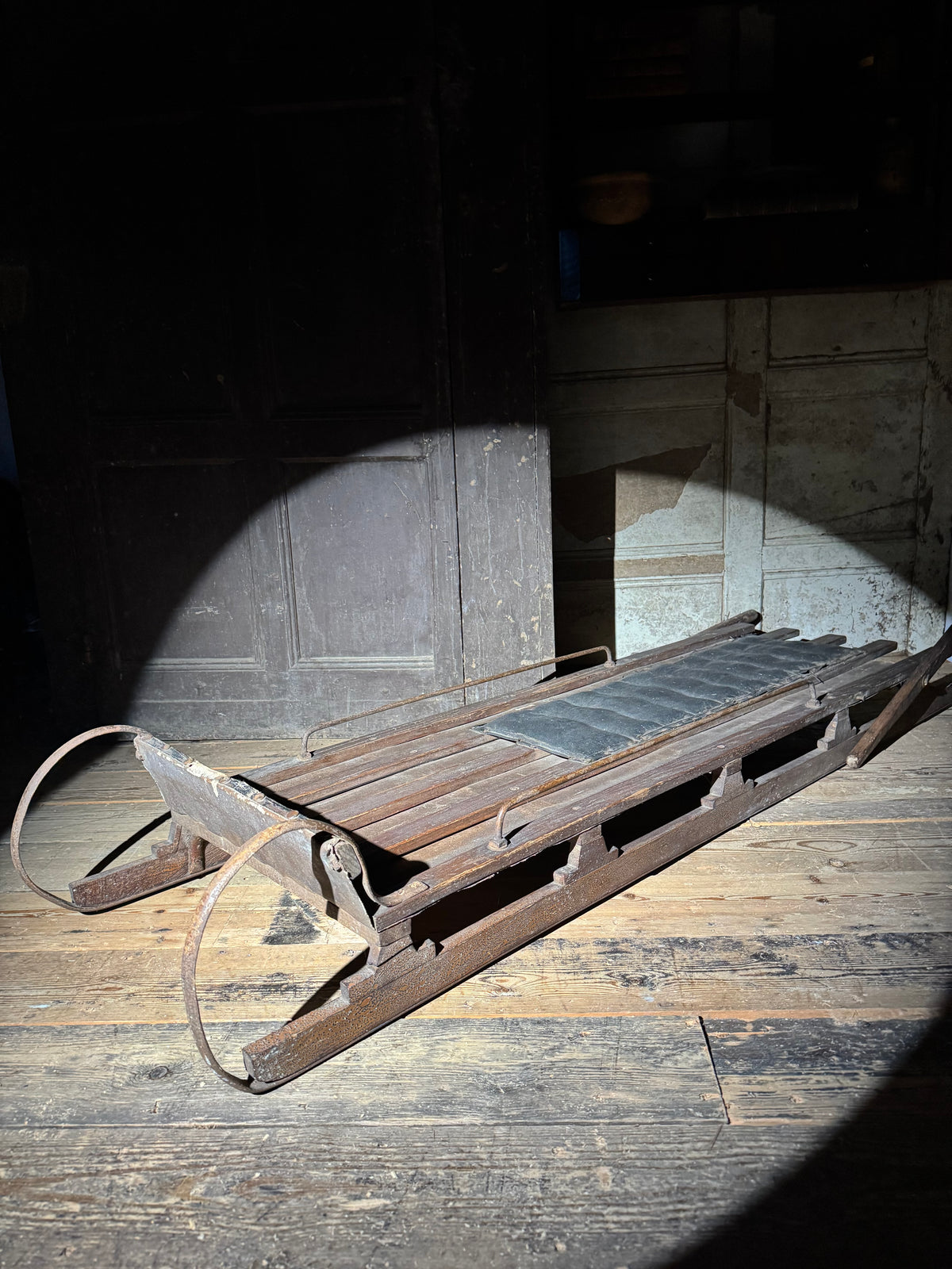Early 20th century wooden toboggan with metal skids and wooden brakes and original seat