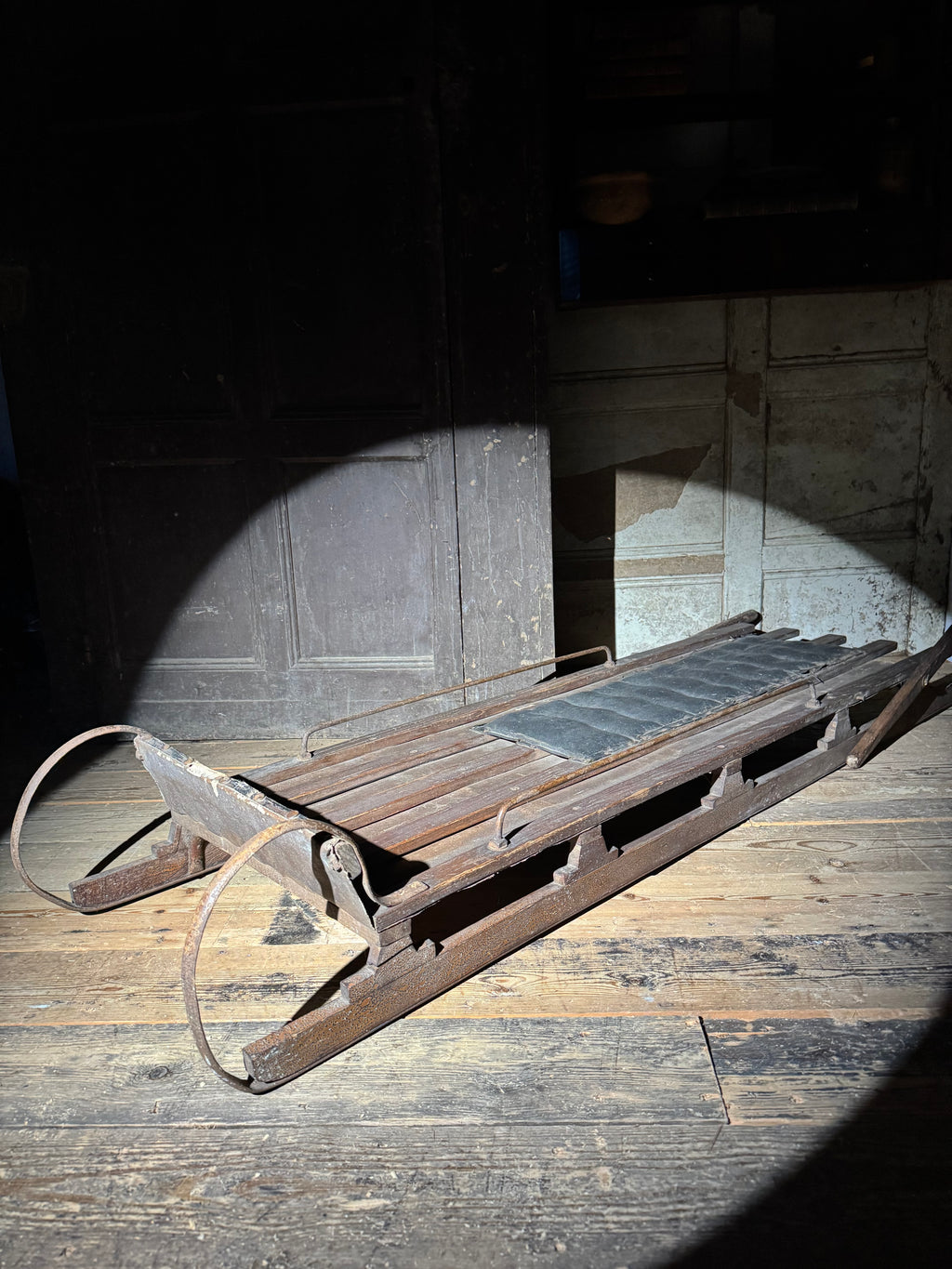Early 20th century wooden toboggan with metal skids and wooden brakes and original seat