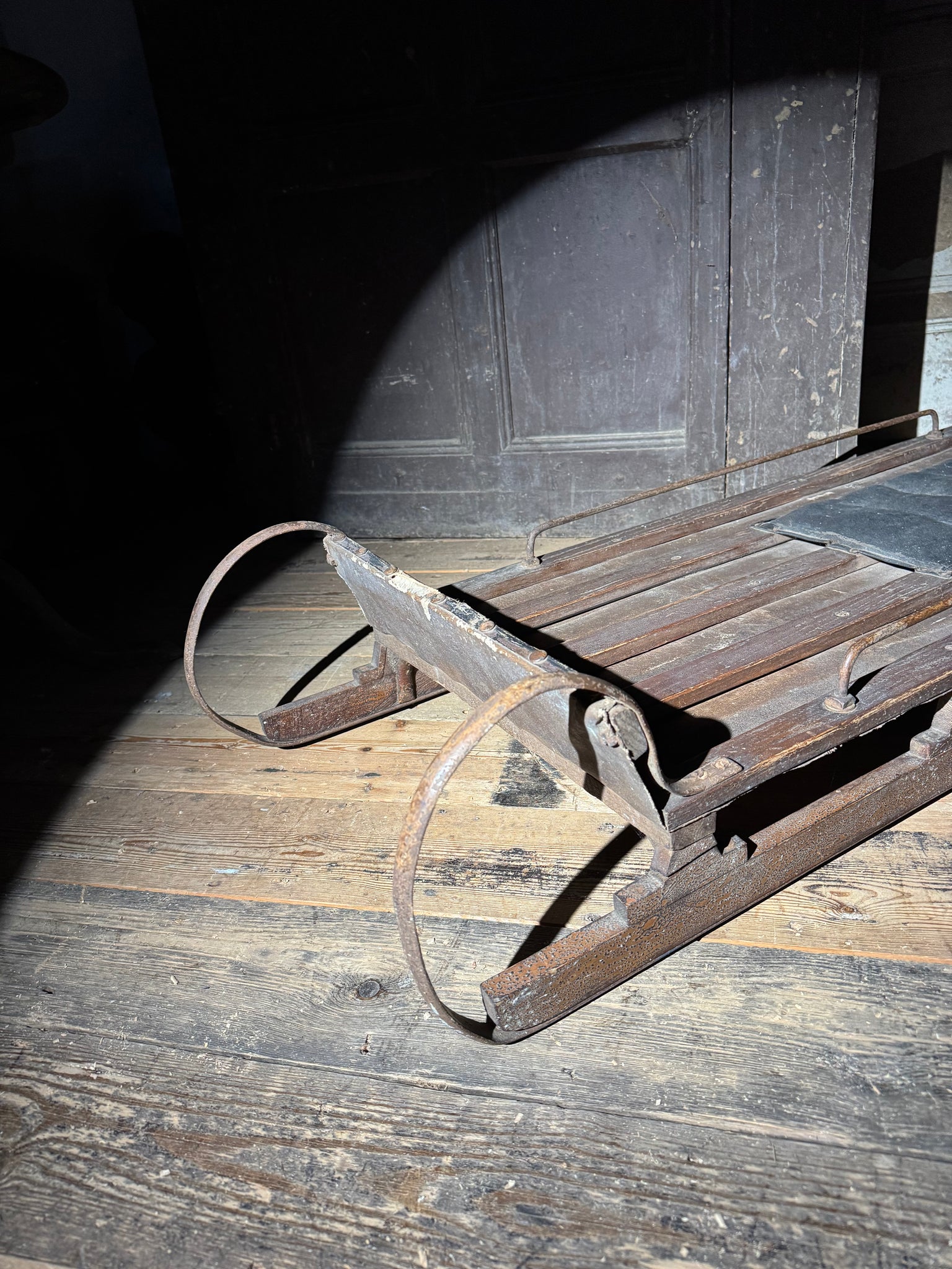Early 20th century wooden toboggan with metal skids and wooden brakes and original seat