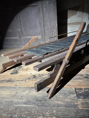 Early 20th century wooden toboggan with metal skids and wooden brakes and original seat