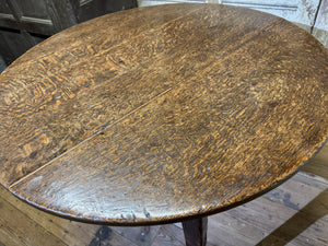 An  early 19th century Welsh oak cricket table of good colour