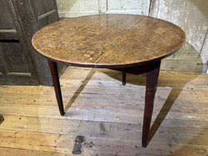 An  early 19th century Welsh oak cricket table of good colour