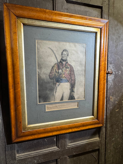 A mid 19th century hand coloured engraving of General Thomas Picton in a birds eye maple frame