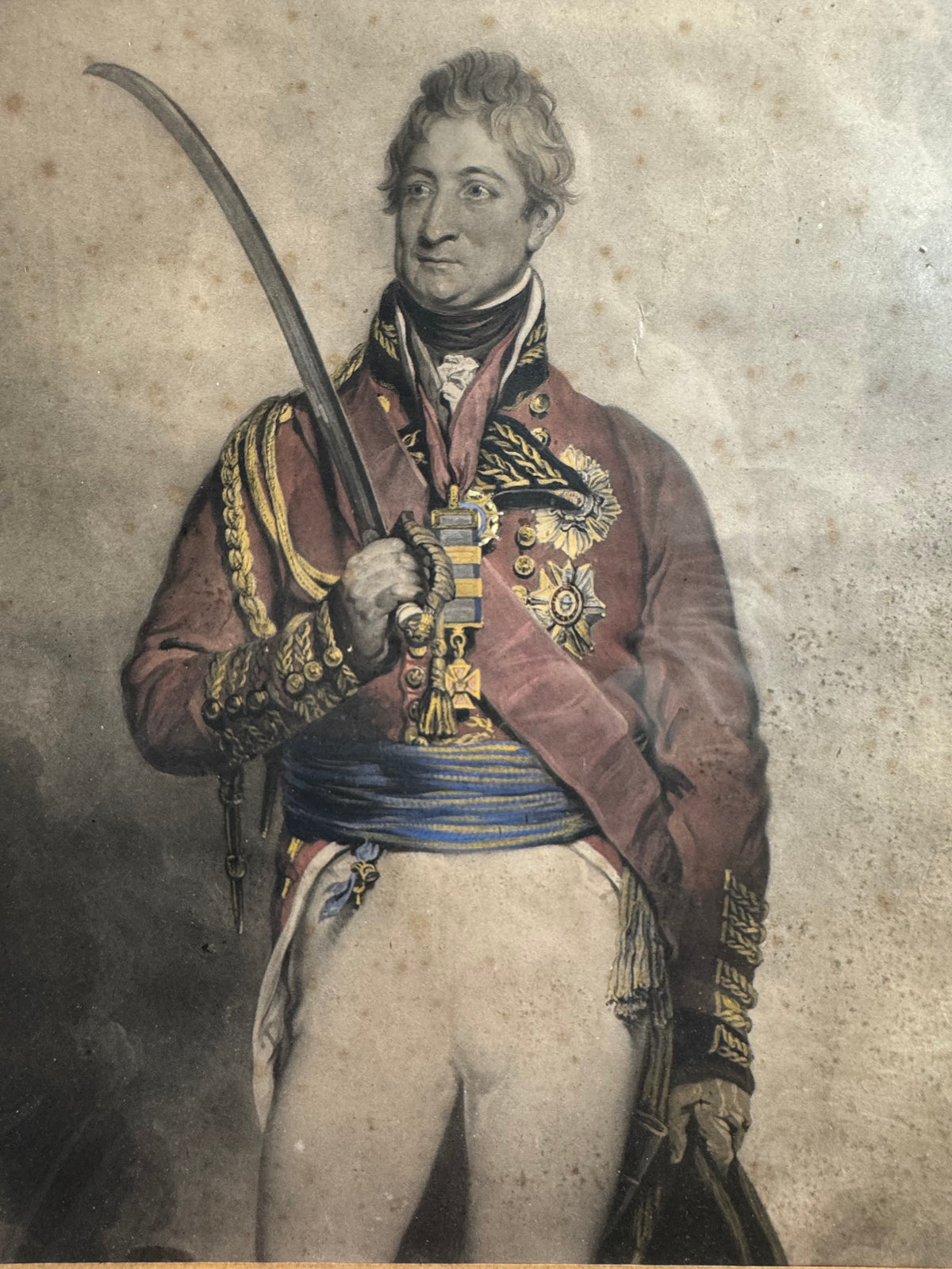 A mid 19th century hand coloured engraving of General Thomas Picton in a birds eye maple frame