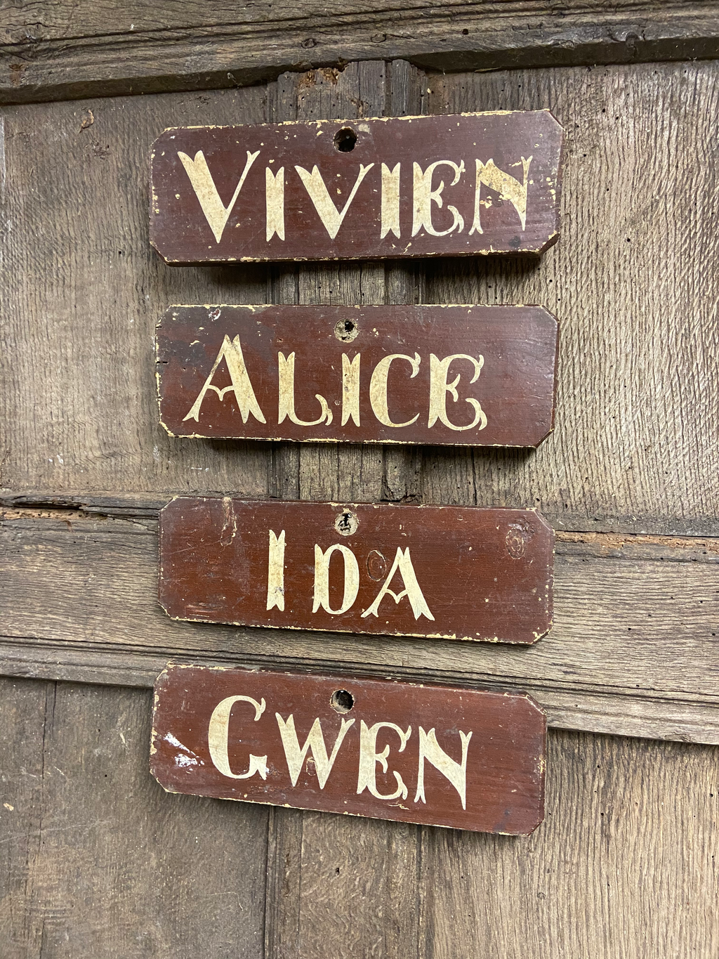 A set of 4 Victorian painted farmhouse shippon cattle name signs