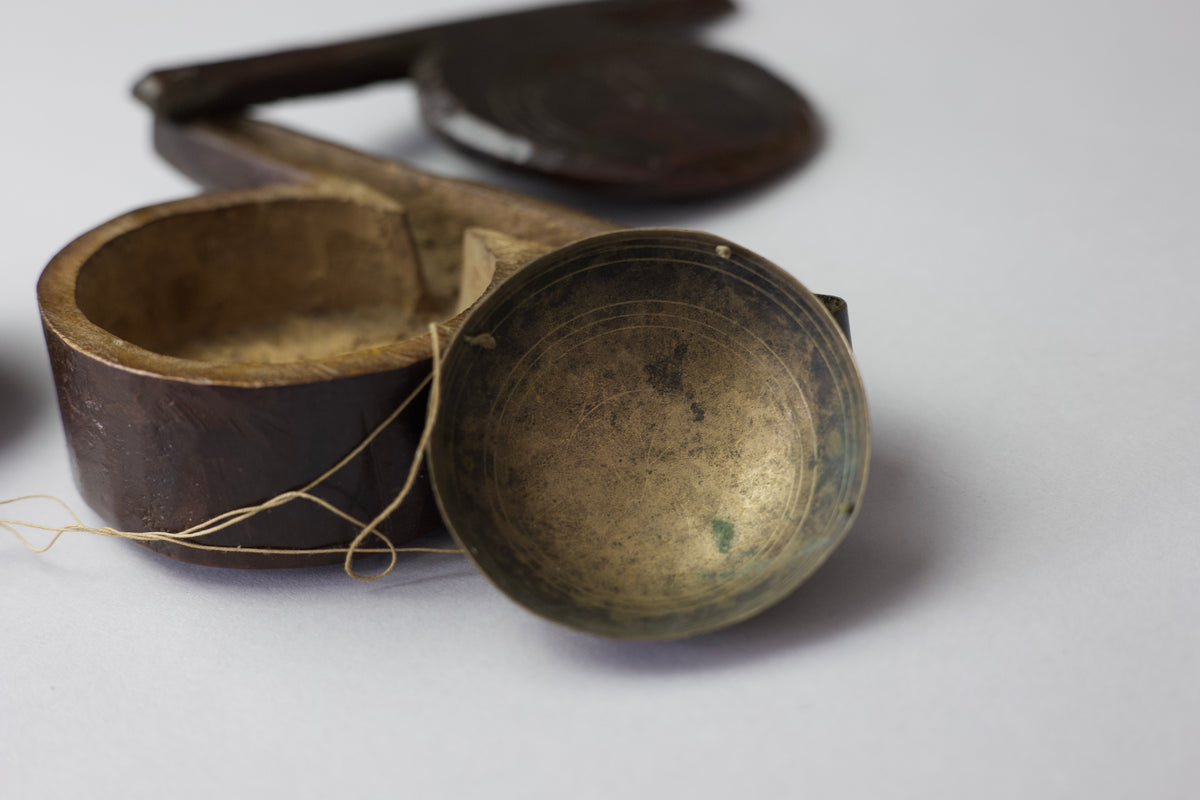 A rare set of 17th century apothecary scales in primitive case with witch marks
