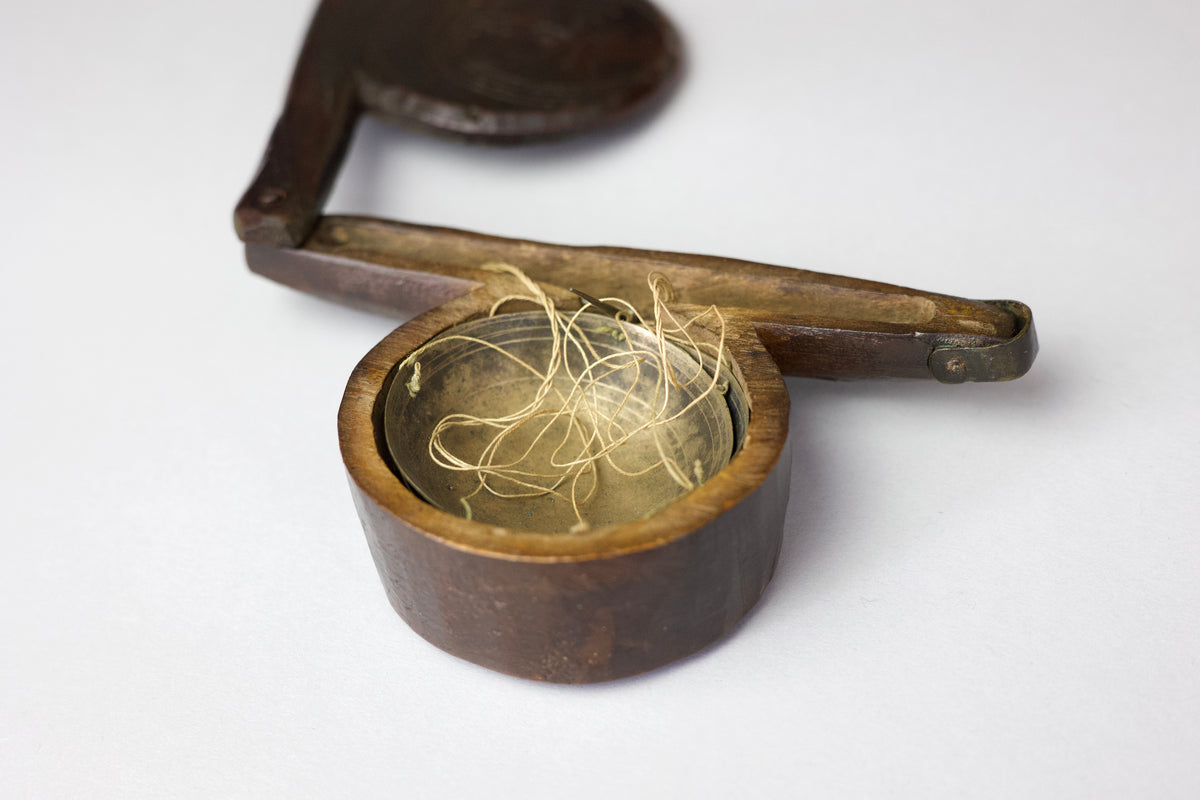 A rare set of 17th century apothecary scales in primitive case with witch marks