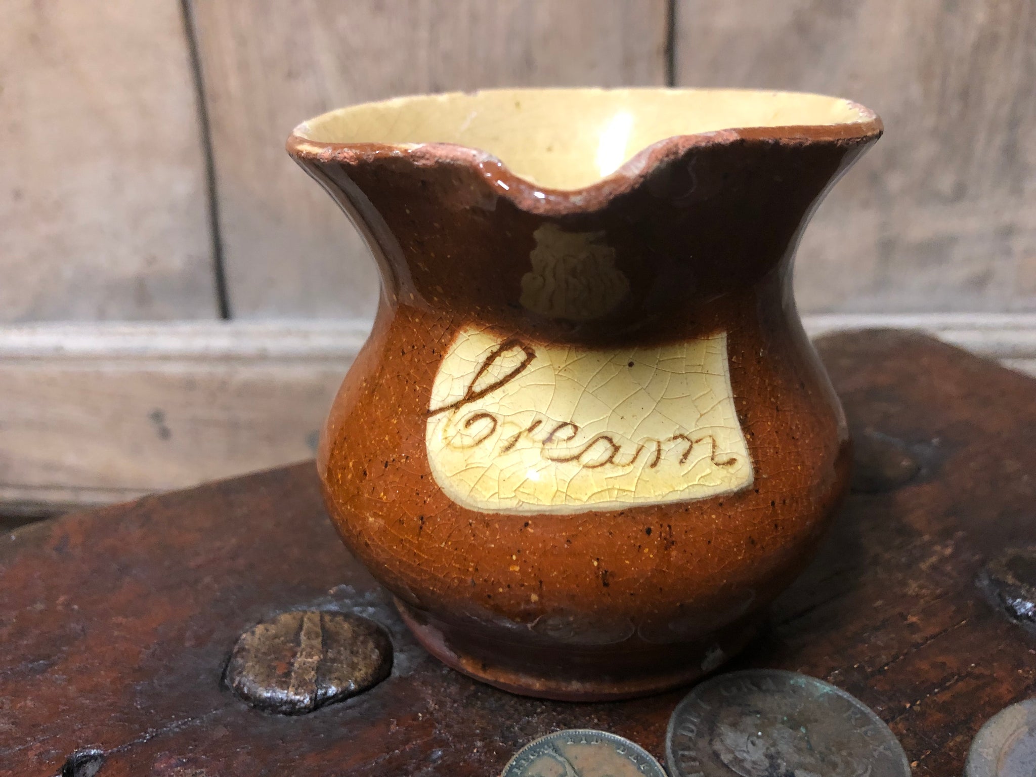 Slipware cream jug by Isaac Button of Halifax