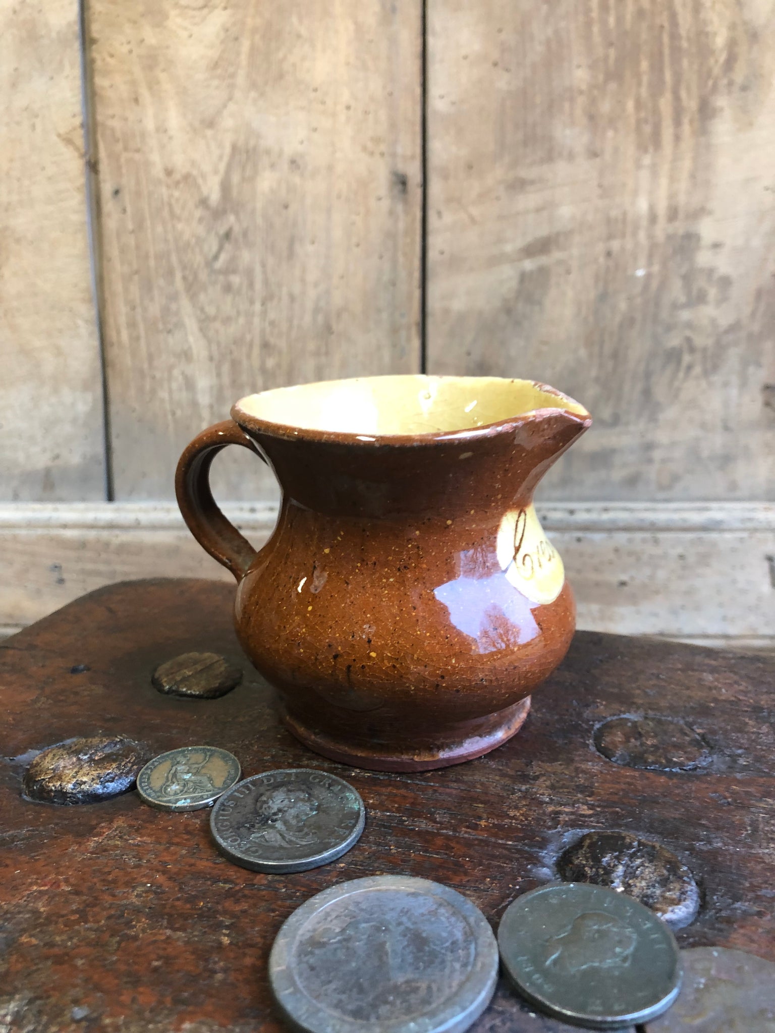 Slipware cream jug by Isaac Button of Halifax