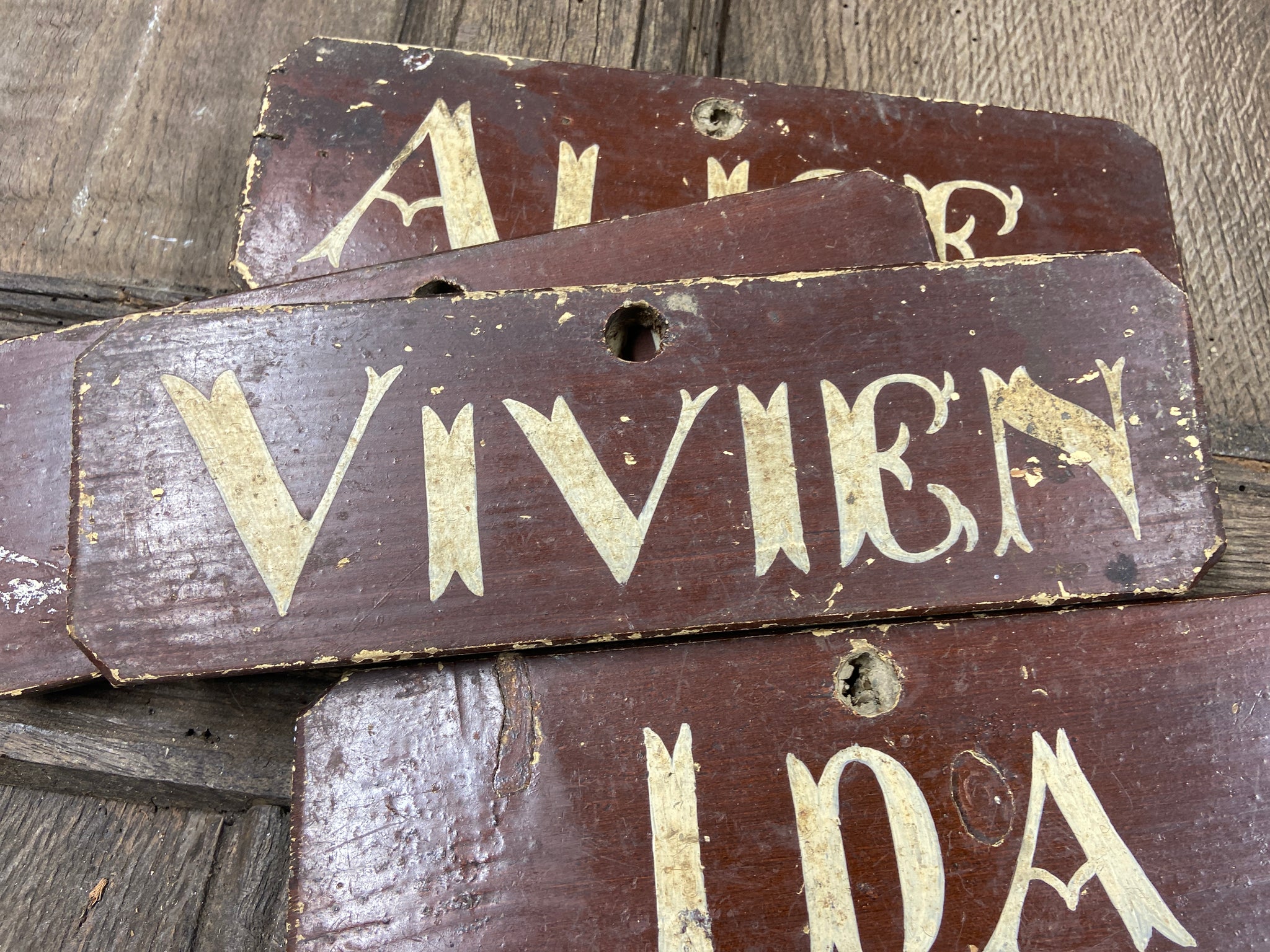 A set of 4 Victorian painted farmhouse shippon cattle name signs