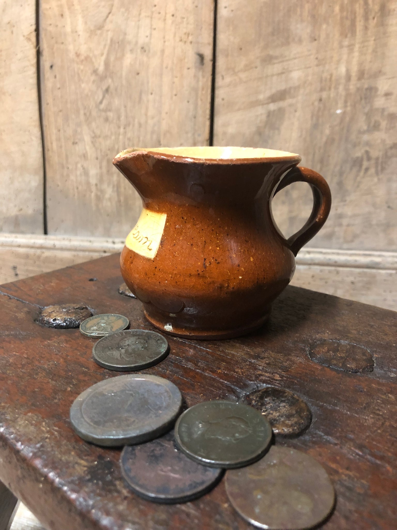 Slipware cream jug by Isaac Button of Halifax