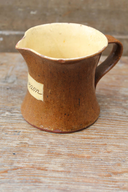 Slipware cream jug by Isaac Button of Halifax