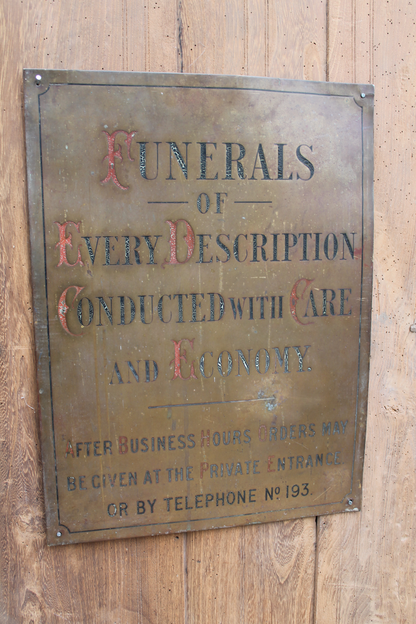 Early 20th century brass funeral sign