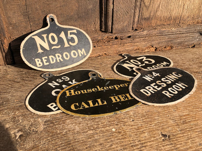 A set of five toleware country house servant's bell signs