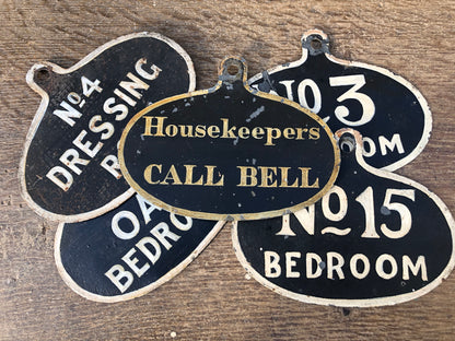 A set of five toleware country house servant's bell signs