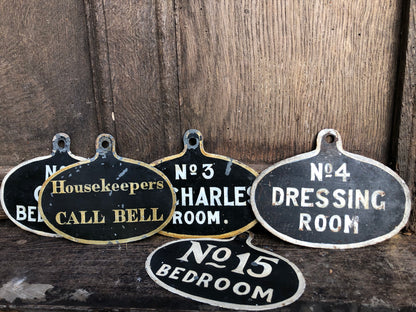 A set of five toleware country house servant's bell signs