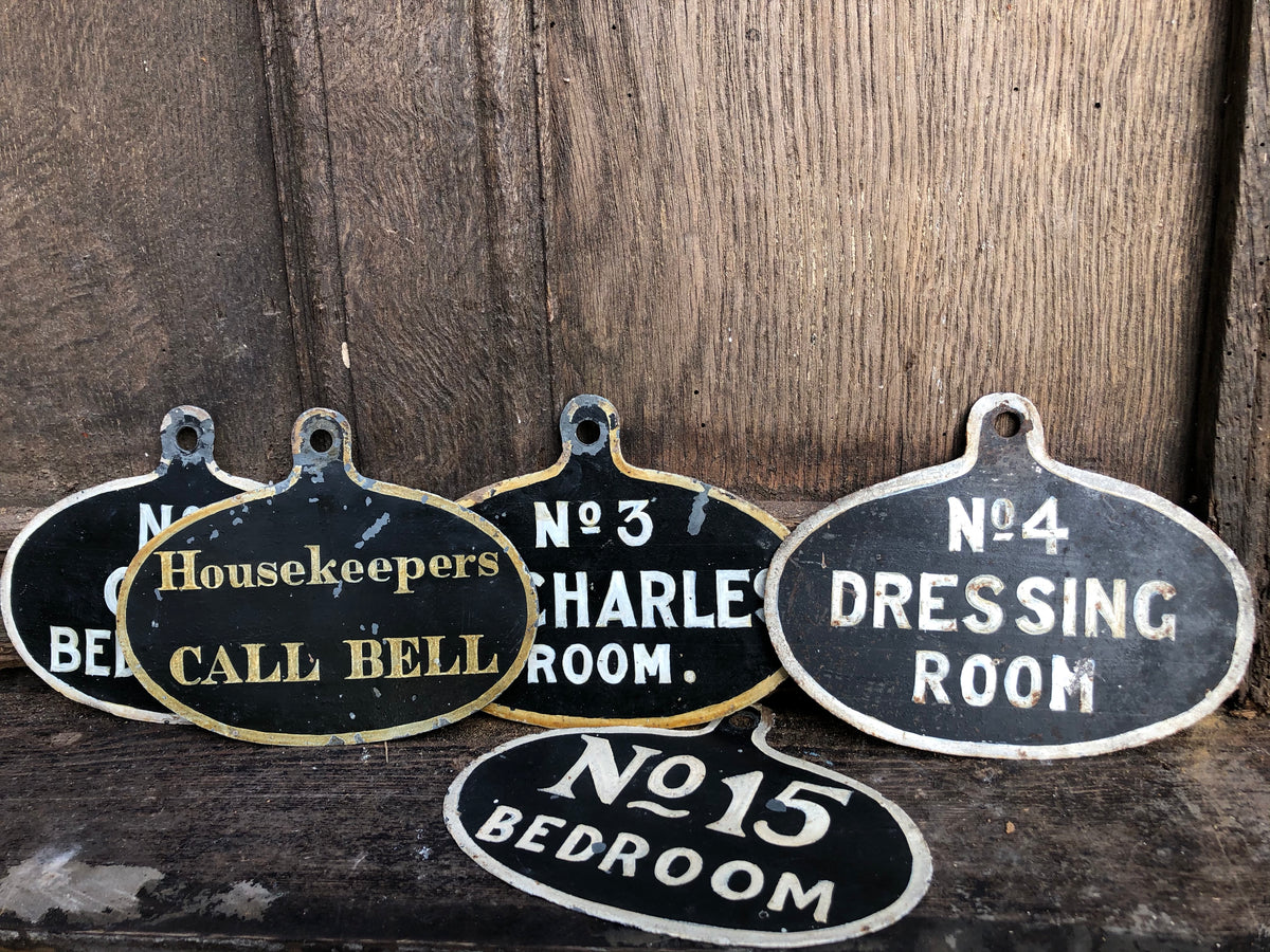 A set of five toleware country house servant's bell signs