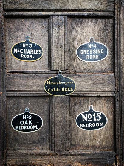 A set of five toleware country house servant's bell signs