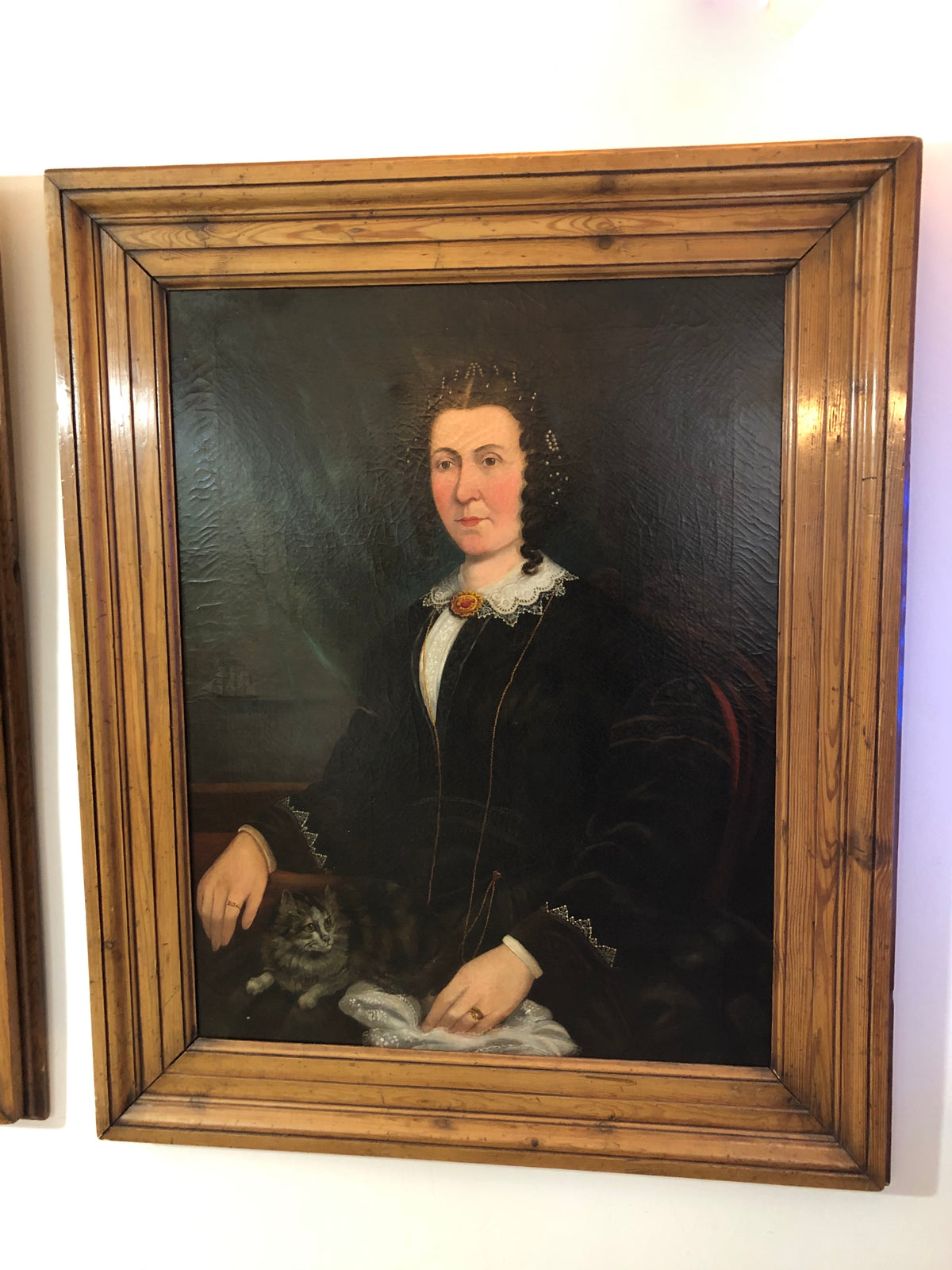 A large pair of portraits of a ship's captain and his wife