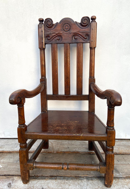 A large 17th c Scottish open arm chair from Braemar Castle