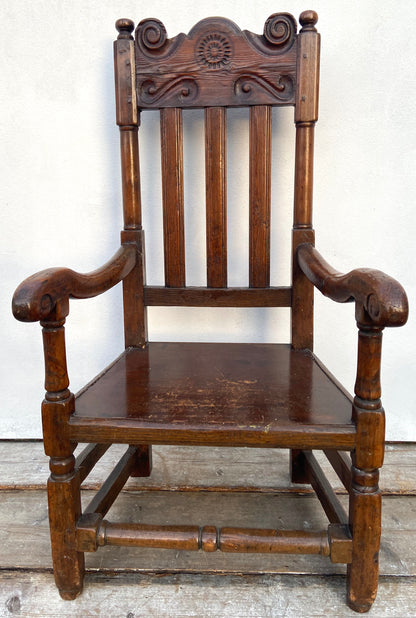 A large 17th c Scottish open arm chair from Braemar Castle