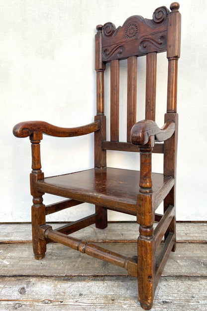A large 17th c Scottish open arm chair from Braemar Castle