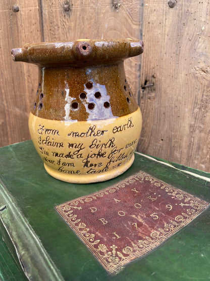 A slipware puzzle jug by Isaac Button of Halifax