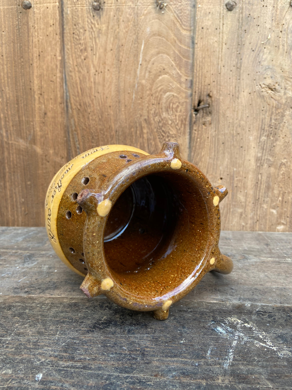 A slipware puzzle jug by Isaac Button of Halifax