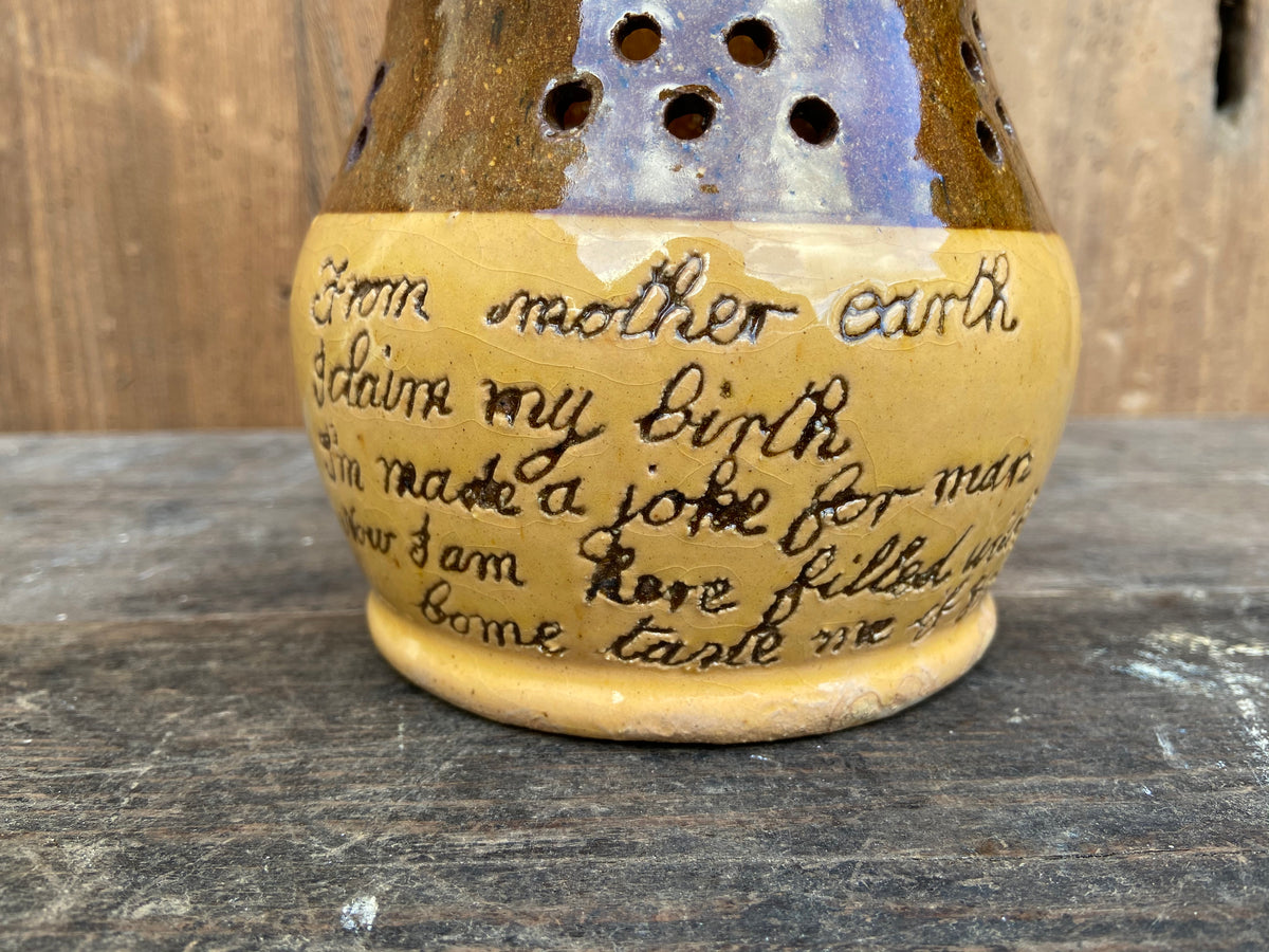 A slipware puzzle jug by Isaac Button of Halifax