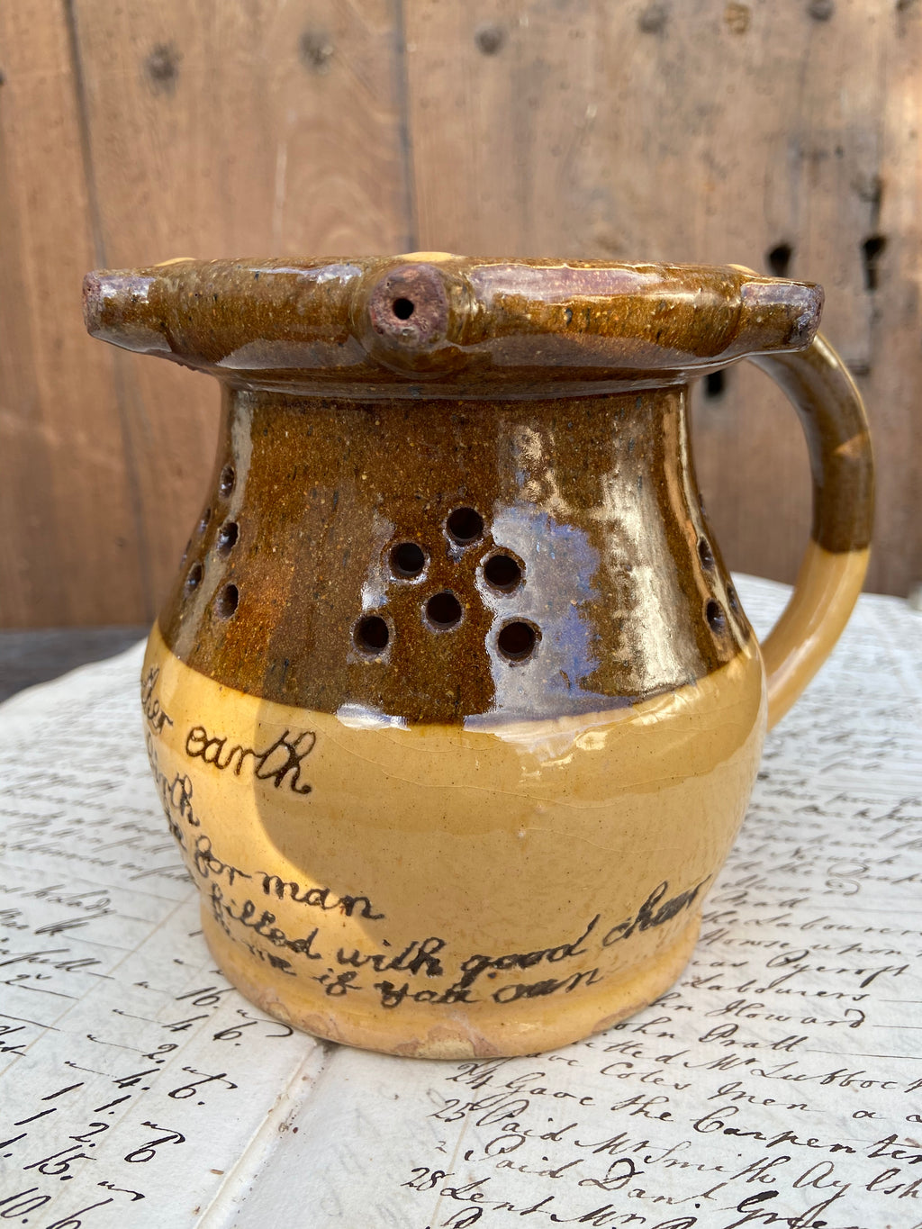 A slipware puzzle jug by Isaac Button of Halifax