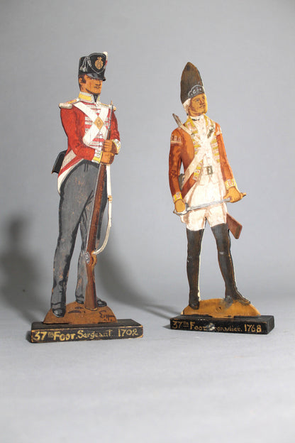 A pair of wooden painted soldiers by Lt E.V Howell c. 1929.