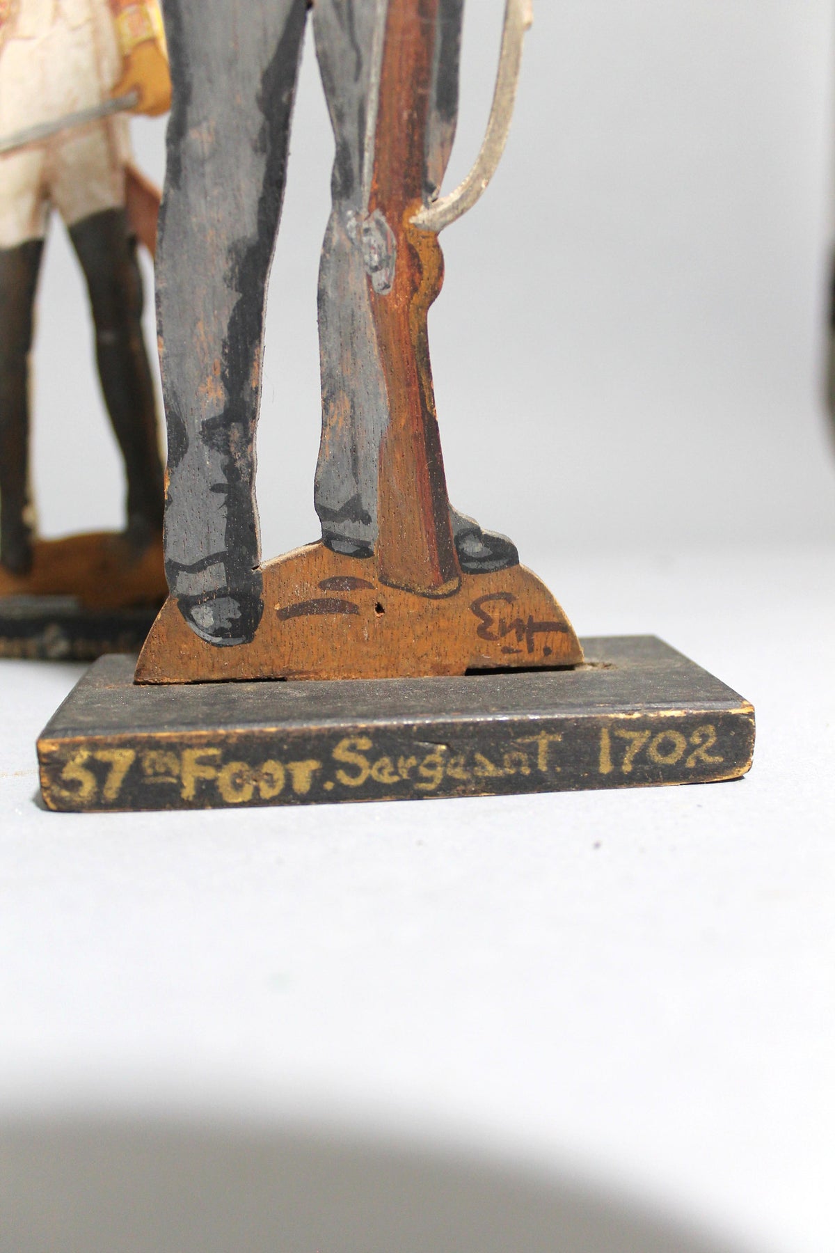 A pair of wooden painted soldiers by Lt E.V Howell c. 1929.