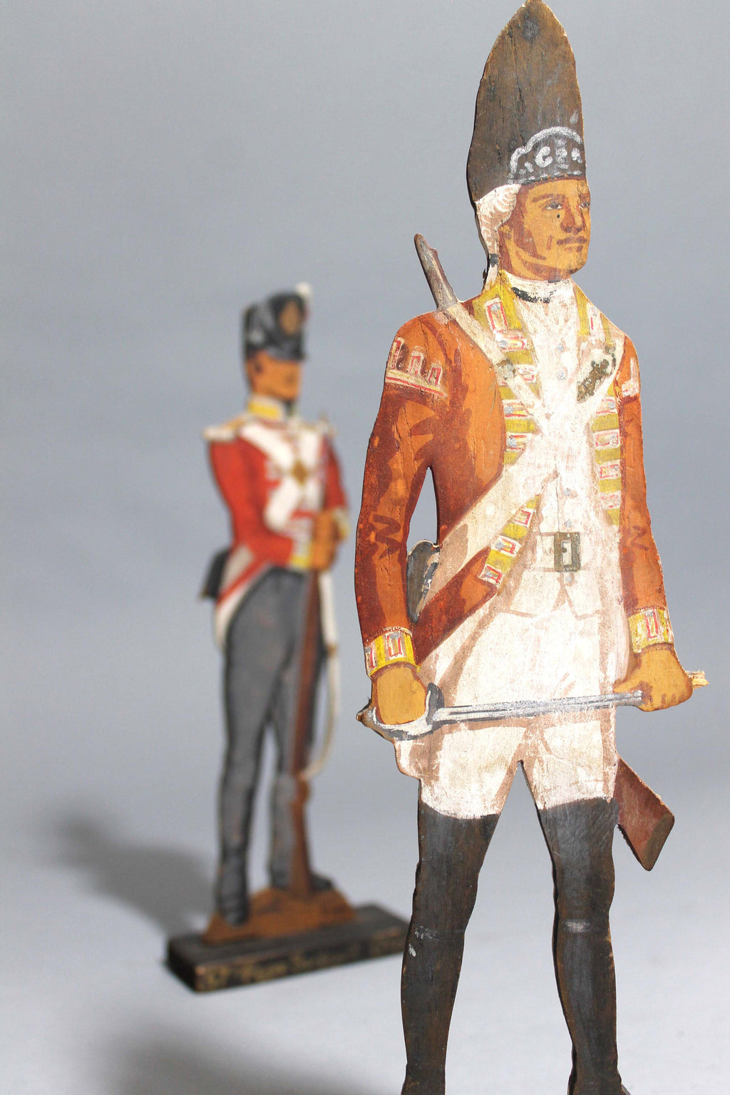 A pair of wooden painted soldiers by Lt E.V Howell c. 1929.