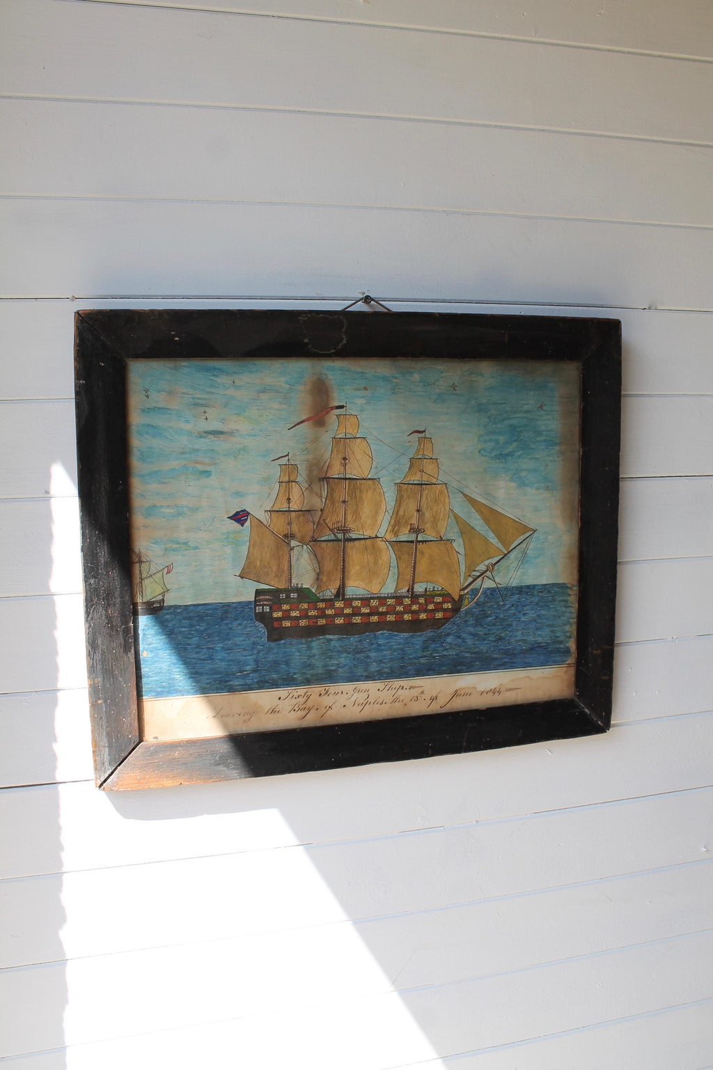 An 1844 naive school pen and watercolour study of a ship leaving Naples - SOLD
