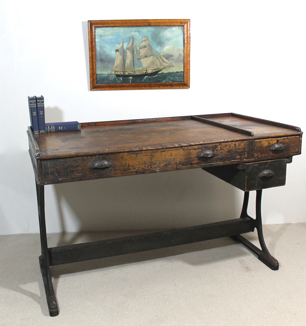 A large 19th century printer's table on a cast iron base