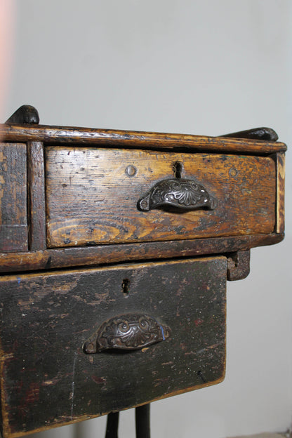 A large 19th century printer's table on a cast iron base