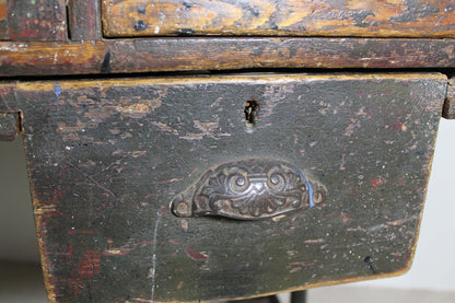 A large 19th century printer's table on a cast iron base