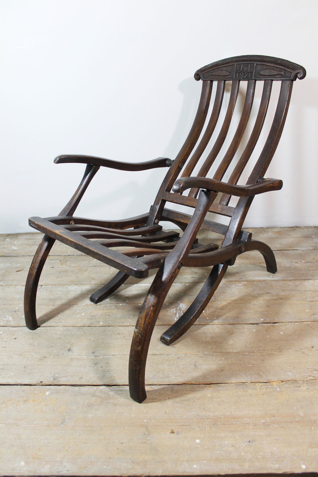 19th century steamer chair with carved dated & initialled crest