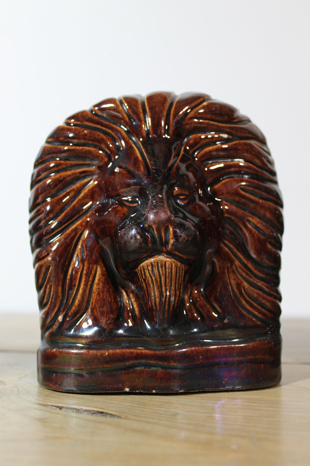 Set of four treacle glazed sash window stops in the form of lions c. 1870