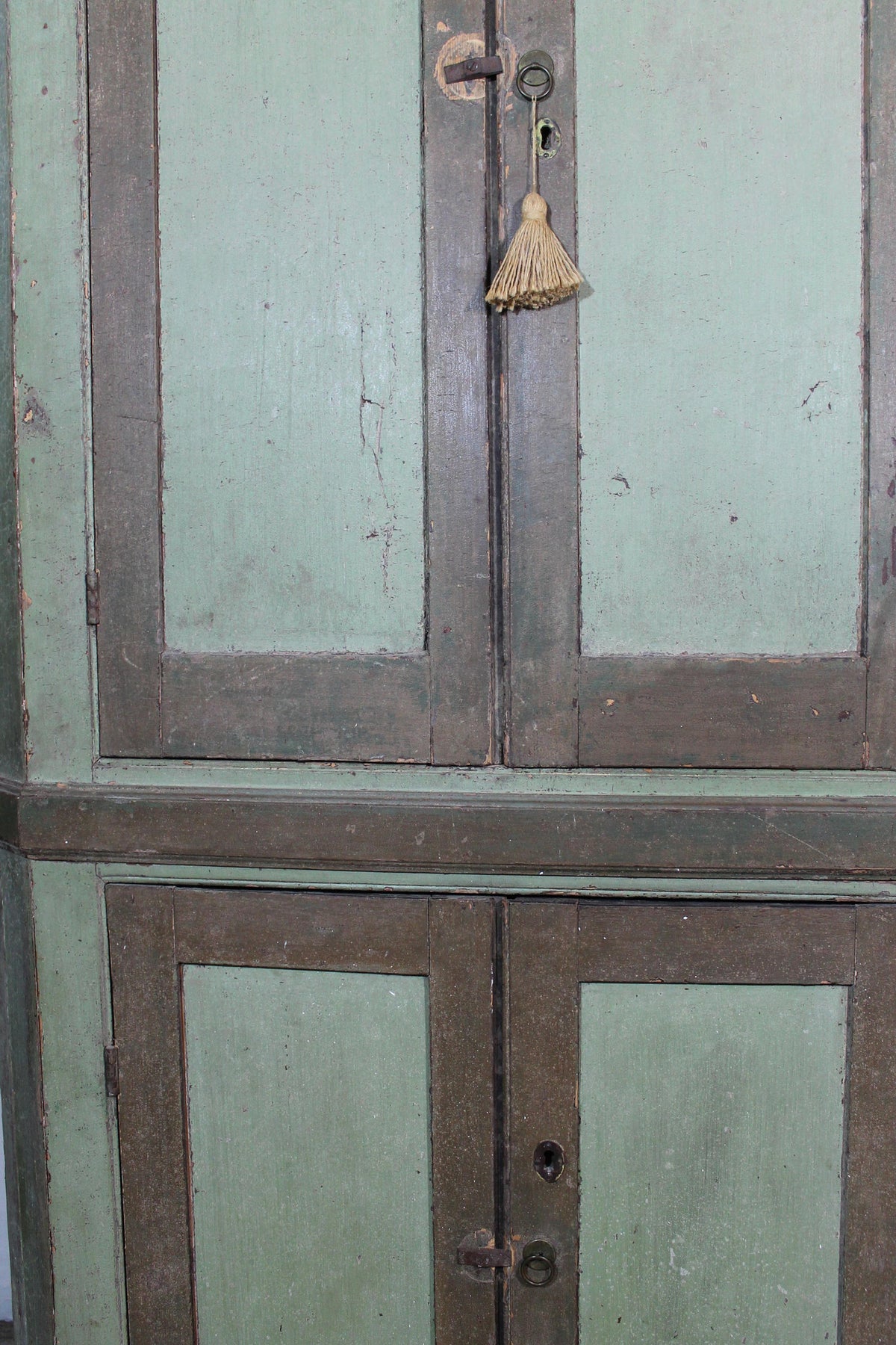 Early 19th century floor standing corner cupboard in original paint