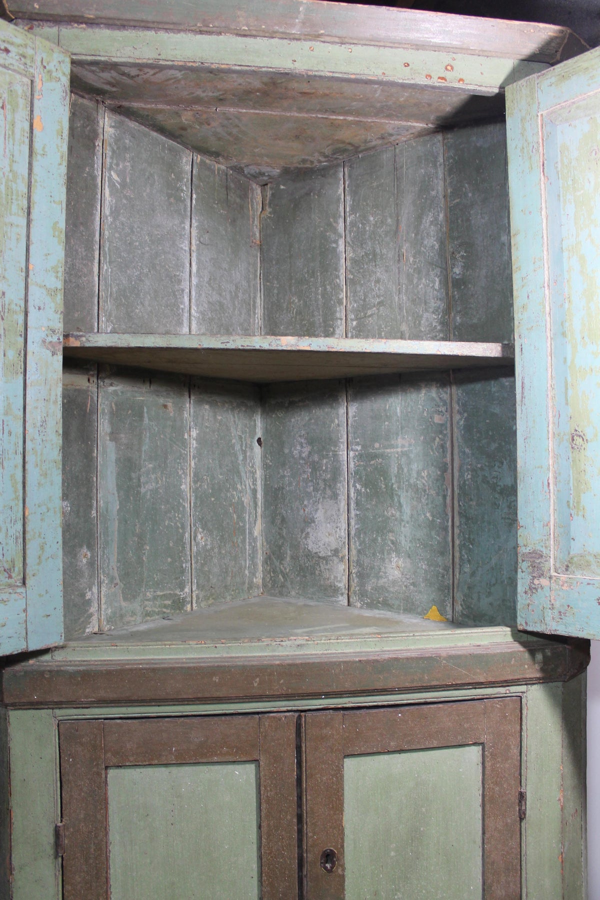 Early 19th century floor standing corner cupboard in original paint