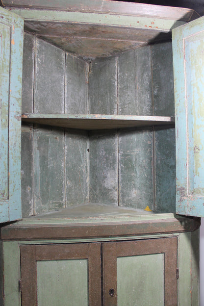 Early 19th century floor standing corner cupboard in original paint