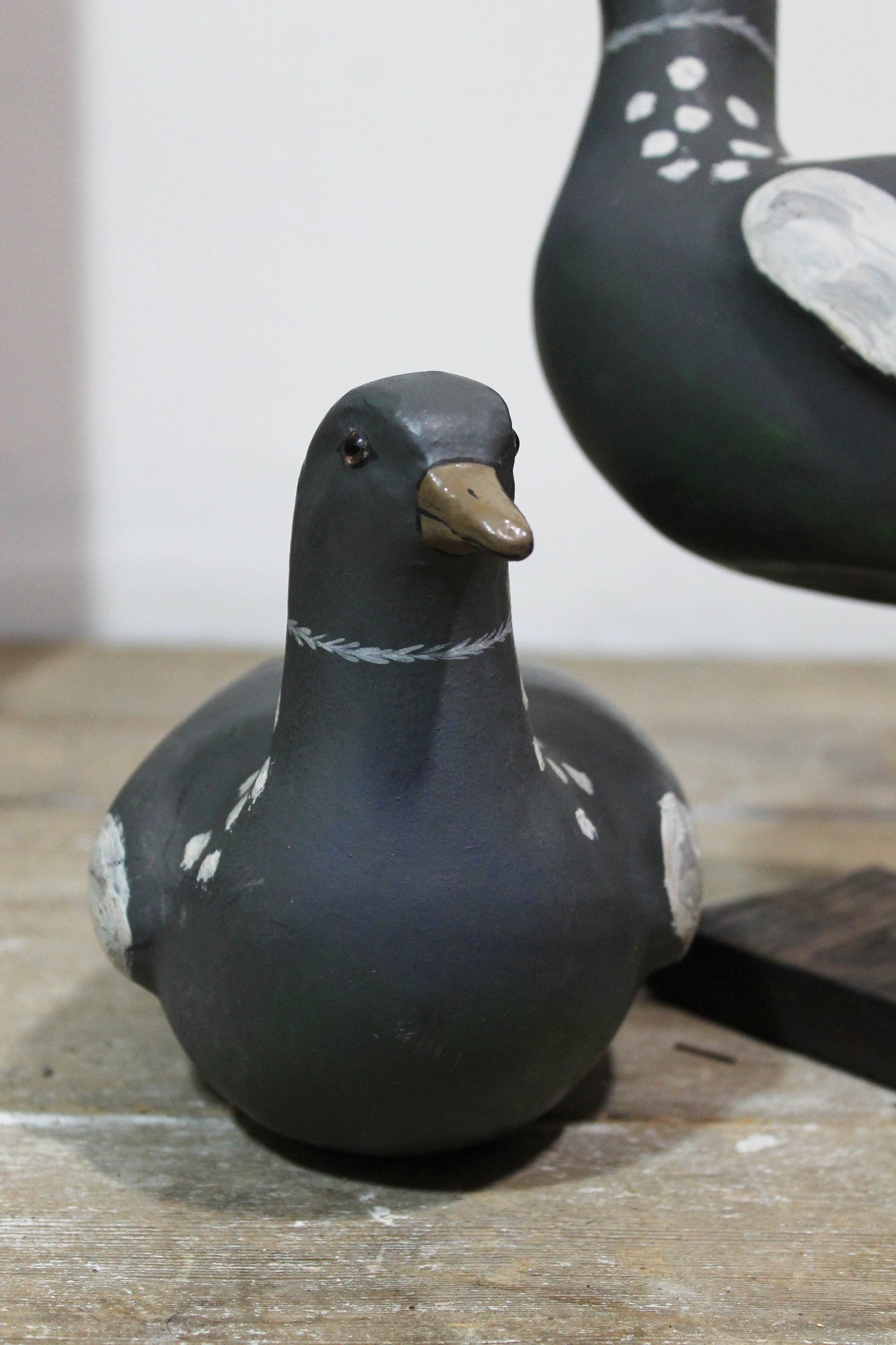 A pair of papier mache decoy pigeons from Plas Gwyn House, Anglesey